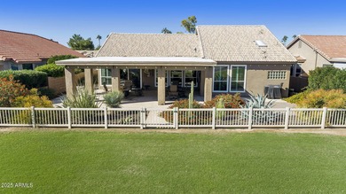 Nestled in a vibrant gated active adult community, this stunning on Palo Verde Golf and Country Club in Arizona - for sale on GolfHomes.com, golf home, golf lot