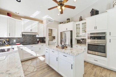 Nestled in a vibrant gated active adult community, this stunning on Palo Verde Golf and Country Club in Arizona - for sale on GolfHomes.com, golf home, golf lot