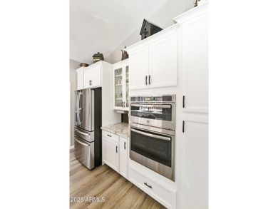 Nestled in a vibrant gated active adult community, this stunning on Palo Verde Golf and Country Club in Arizona - for sale on GolfHomes.com, golf home, golf lot