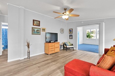 Discover this beautifully updated split-bedroom home featuring on Barefoot Bay Golf Course in Florida - for sale on GolfHomes.com, golf home, golf lot