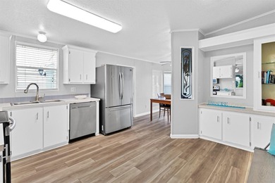 Discover this beautifully updated split-bedroom home featuring on Barefoot Bay Golf Course in Florida - for sale on GolfHomes.com, golf home, golf lot