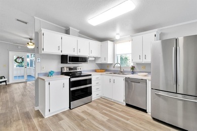 Discover this beautifully updated split-bedroom home featuring on Barefoot Bay Golf Course in Florida - for sale on GolfHomes.com, golf home, golf lot