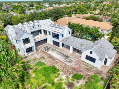 Experience the height of elegance and sophistication in this on Jonathans Landing Golf Club in Florida - for sale on GolfHomes.com, golf home, golf lot