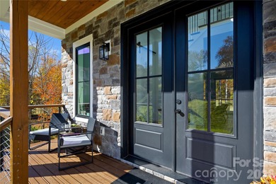 Experience modern elegance and breathtaking golf course views in on Verdict Ridge Golf and Country Club in North Carolina - for sale on GolfHomes.com, golf home, golf lot