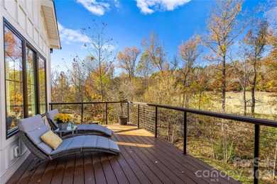 Experience modern elegance and breathtaking golf course views in on Verdict Ridge Golf and Country Club in North Carolina - for sale on GolfHomes.com, golf home, golf lot