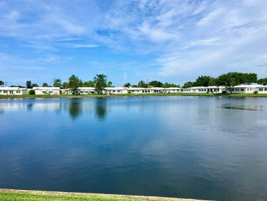 Beautiful waterview at this stunning 2 bedroom, 2 bath, 2 car on Mainlands Golf Club in Florida - for sale on GolfHomes.com, golf home, golf lot