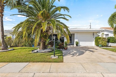Located in Mainlands of Tamarac by the Gulf, this updated on Mainlands Golf Club in Florida - for sale on GolfHomes.com, golf home, golf lot
