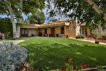 Santa Fe style home in South Redlands. The adobe home built in on Redlands Country Club in California - for sale on GolfHomes.com, golf home, golf lot
