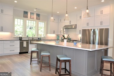 With beautiful lake views, this home is located in the sought on Reynolds Lake Oconee - The Oconee in Georgia - for sale on GolfHomes.com, golf home, golf lot