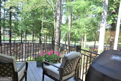 With beautiful lake views, this home is located in the sought on Reynolds Lake Oconee - The Oconee in Georgia - for sale on GolfHomes.com, golf home, golf lot