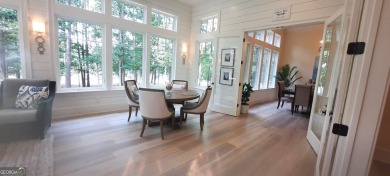 With beautiful lake views, this home is located in the sought on Reynolds Lake Oconee - The Oconee in Georgia - for sale on GolfHomes.com, golf home, golf lot