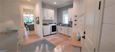 With beautiful lake views, this home is located in the sought on Reynolds Lake Oconee - The Oconee in Georgia - for sale on GolfHomes.com, golf home, golf lot
