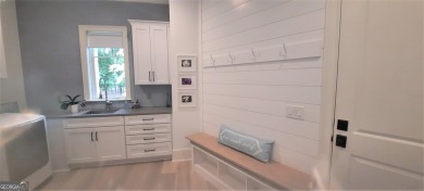 With beautiful lake views, this home is located in the sought on Reynolds Lake Oconee - The Oconee in Georgia - for sale on GolfHomes.com, golf home, golf lot