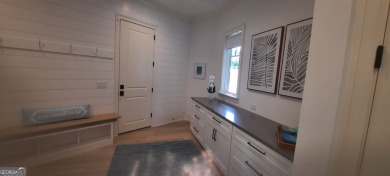 With beautiful lake views, this home is located in the sought on Reynolds Lake Oconee - The Oconee in Georgia - for sale on GolfHomes.com, golf home, golf lot