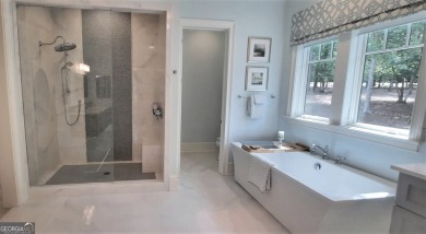 With beautiful lake views, this home is located in the sought on Reynolds Lake Oconee - The Oconee in Georgia - for sale on GolfHomes.com, golf home, golf lot