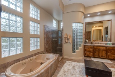 Contemporary elegance abounds in this custom masterpiece in on Troon North Golf Club  in Arizona - for sale on GolfHomes.com, golf home, golf lot