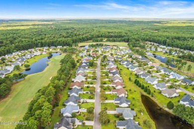 Come and see this spacious 3-bedroom home with private back yard on Sandpiper Bay Golf and Country Club in North Carolina - for sale on GolfHomes.com, golf home, golf lot