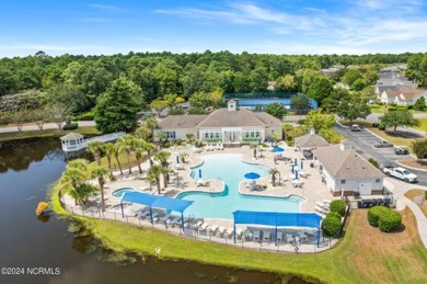 Come and see this spacious 3-bedroom home with private back yard on Sandpiper Bay Golf and Country Club in North Carolina - for sale on GolfHomes.com, golf home, golf lot