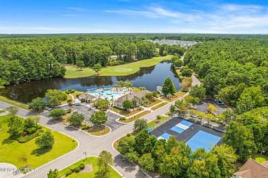 Come and see this spacious 3-bedroom home with private back yard on Sandpiper Bay Golf and Country Club in North Carolina - for sale on GolfHomes.com, golf home, golf lot