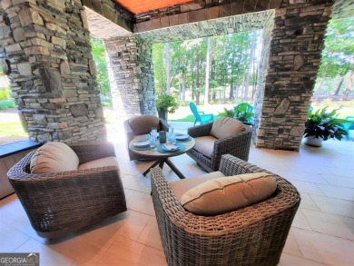 With beautiful lake views, this home is located in the sought on Reynolds Lake Oconee - The Oconee in Georgia - for sale on GolfHomes.com, golf home, golf lot