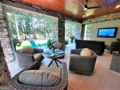 With beautiful lake views, this home is located in the sought on Reynolds Lake Oconee - The Oconee in Georgia - for sale on GolfHomes.com, golf home, golf lot