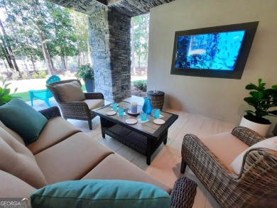 With beautiful lake views, this home is located in the sought on Reynolds Lake Oconee - The Oconee in Georgia - for sale on GolfHomes.com, golf home, golf lot