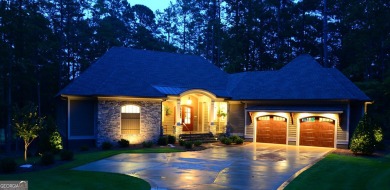With beautiful lake views, this home is located in the sought on Reynolds Lake Oconee - The Oconee in Georgia - for sale on GolfHomes.com, golf home, golf lot