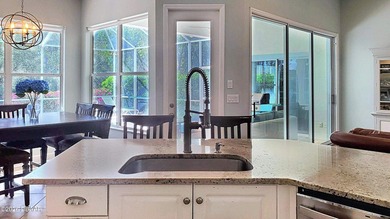 Welcome to your private Florida retreat! This spacious 4-bedroom on Plantation Bay Golf and Country Club in Florida - for sale on GolfHomes.com, golf home, golf lot