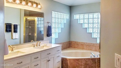 Welcome to your private Florida retreat! This spacious 4-bedroom on Plantation Bay Golf and Country Club in Florida - for sale on GolfHomes.com, golf home, golf lot