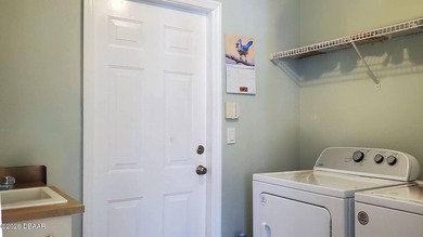 Welcome to your private Florida retreat! This spacious 4-bedroom on Plantation Bay Golf and Country Club in Florida - for sale on GolfHomes.com, golf home, golf lot