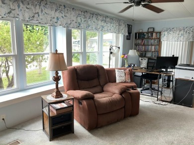 Beautiful and serene 2BR/2BA home with stunning golf course on Fairways Country Club in Florida - for sale on GolfHomes.com, golf home, golf lot