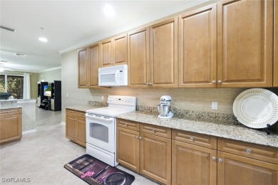 Welcome to this stylish and spacious second-floor carriage home on Gateway Golf and Country Club in Florida - for sale on GolfHomes.com, golf home, golf lot