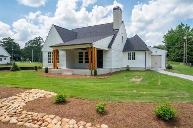 Welcome to this stunning custom-built residence nestled in the on Sunset Hills Country Club in Georgia - for sale on GolfHomes.com, golf home, golf lot