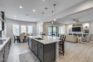 PRICED BELOW MARKET - MOVE-IN READY WITH OVER $73K IN BUILDER on Poston Butte Golf Club in Arizona - for sale on GolfHomes.com, golf home, golf lot