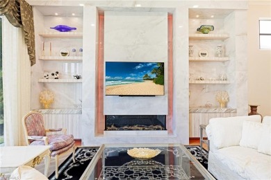 This exceptional 3-bedroom plus den, 3.5-bathroom estate home in on West Bay Beach and Golf Club in Florida - for sale on GolfHomes.com, golf home, golf lot