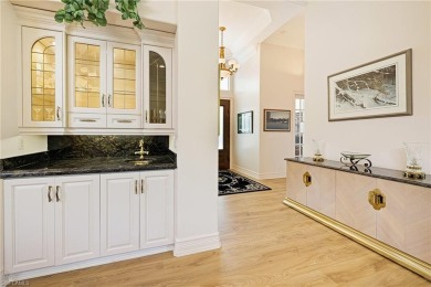 This exceptional 3-bedroom plus den, 3.5-bathroom estate home in on West Bay Beach and Golf Club in Florida - for sale on GolfHomes.com, golf home, golf lot