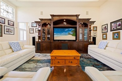This exceptional 3-bedroom plus den, 3.5-bathroom estate home in on West Bay Beach and Golf Club in Florida - for sale on GolfHomes.com, golf home, golf lot