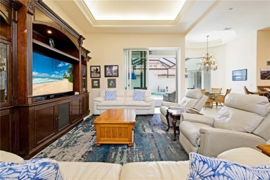 This exceptional 3-bedroom plus den, 3.5-bathroom estate home in on West Bay Beach and Golf Club in Florida - for sale on GolfHomes.com, golf home, golf lot
