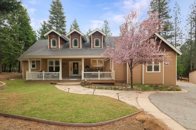 Let the custom stamped driveway lead you to the composited front on Lake Almanor Country Club in California - for sale on GolfHomes.com, golf home, golf lot