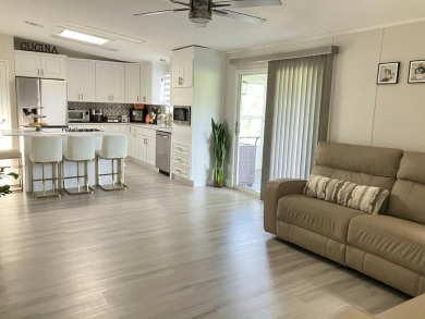 Beautifully remodeled 3BR/2BA home in a vibrant 55+ active on Fairways Country Club in Florida - for sale on GolfHomes.com, golf home, golf lot