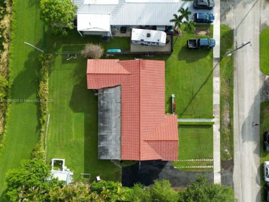 Welcome to 9480 Palmetto Club Ln E--an updated 4-bed, 2-bath on Palmetto Golf Course in Florida - for sale on GolfHomes.com, golf home, golf lot