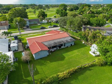 Welcome to 9480 Palmetto Club Ln E--an updated 4-bed, 2-bath on Palmetto Golf Course in Florida - for sale on GolfHomes.com, golf home, golf lot