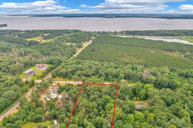 Here's your chance to own just under 1.5 acres of wooded land on Lake Arrowhead Golf Course - The Lakes in Wisconsin - for sale on GolfHomes.com, golf home, golf lot