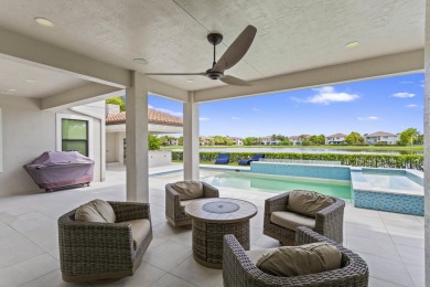 This stunning 5-bed, 6-bath lakefront estate blends modern on Parkland Golf Club in Florida - for sale on GolfHomes.com, golf home, golf lot