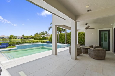 This stunning 5-bed, 6-bath lakefront estate blends modern on Parkland Golf Club in Florida - for sale on GolfHomes.com, golf home, golf lot