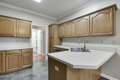 219 Oligi Circle is a charming single-story brick home located on Toqua Golf Course - Loudon County in Tennessee - for sale on GolfHomes.com, golf home, golf lot