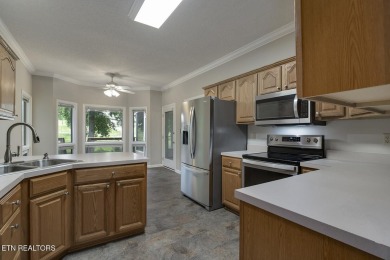 219 Oligi Circle is a charming single-story brick home located on Toqua Golf Course - Loudon County in Tennessee - for sale on GolfHomes.com, golf home, golf lot