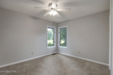 219 Oligi Circle is a charming single-story brick home located on Toqua Golf Course - Loudon County in Tennessee - for sale on GolfHomes.com, golf home, golf lot