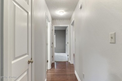 219 Oligi Circle is a charming single-story brick home located on Toqua Golf Course - Loudon County in Tennessee - for sale on GolfHomes.com, golf home, golf lot