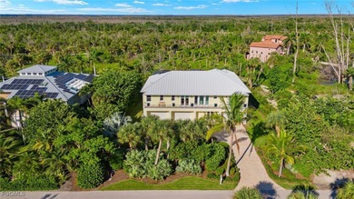 Experience island living at its finest with this stunning on The Sanctuary Golf Club in Florida - for sale on GolfHomes.com, golf home, golf lot